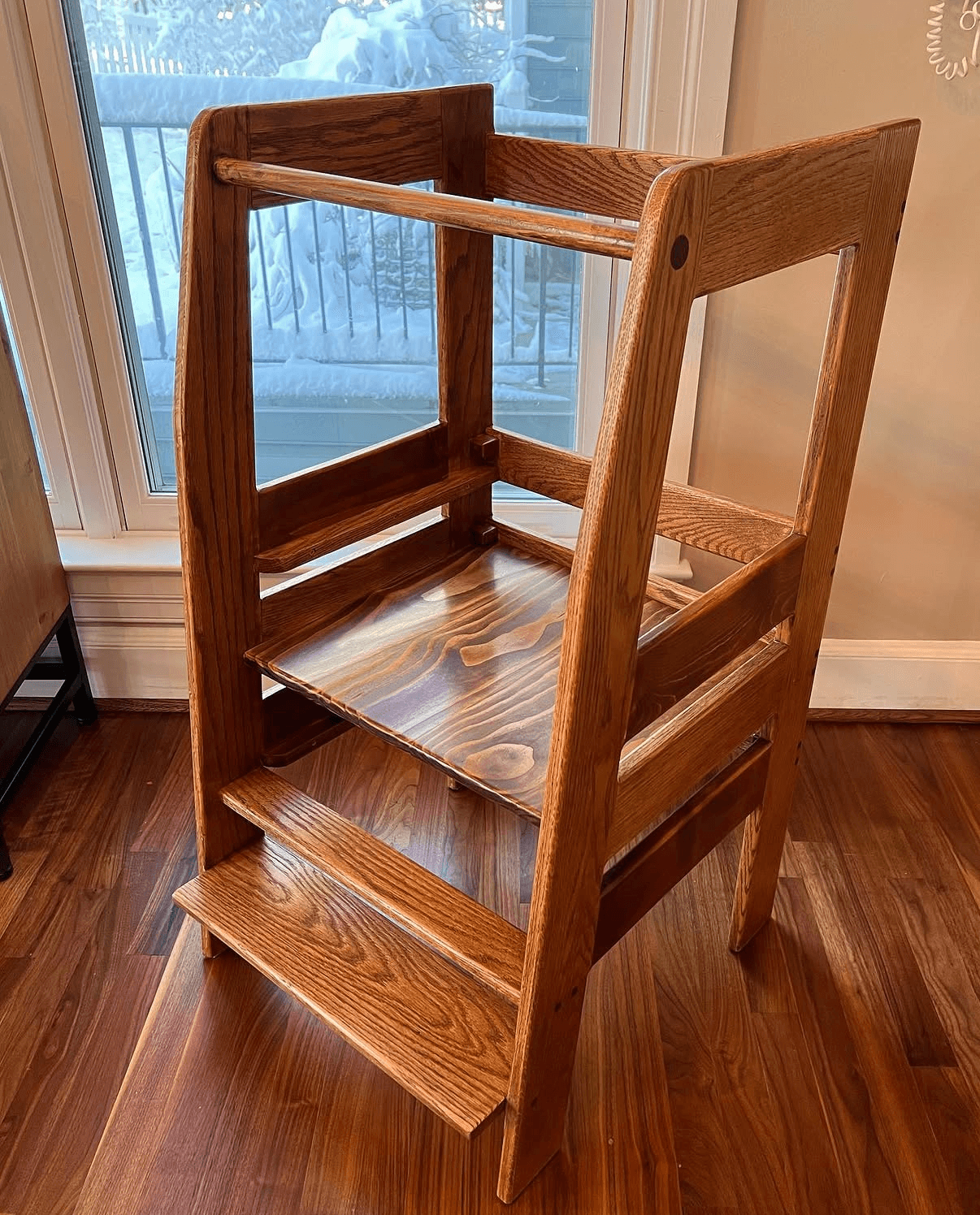 Oak toddler tower with steps, a raised platform, and surrounding rails