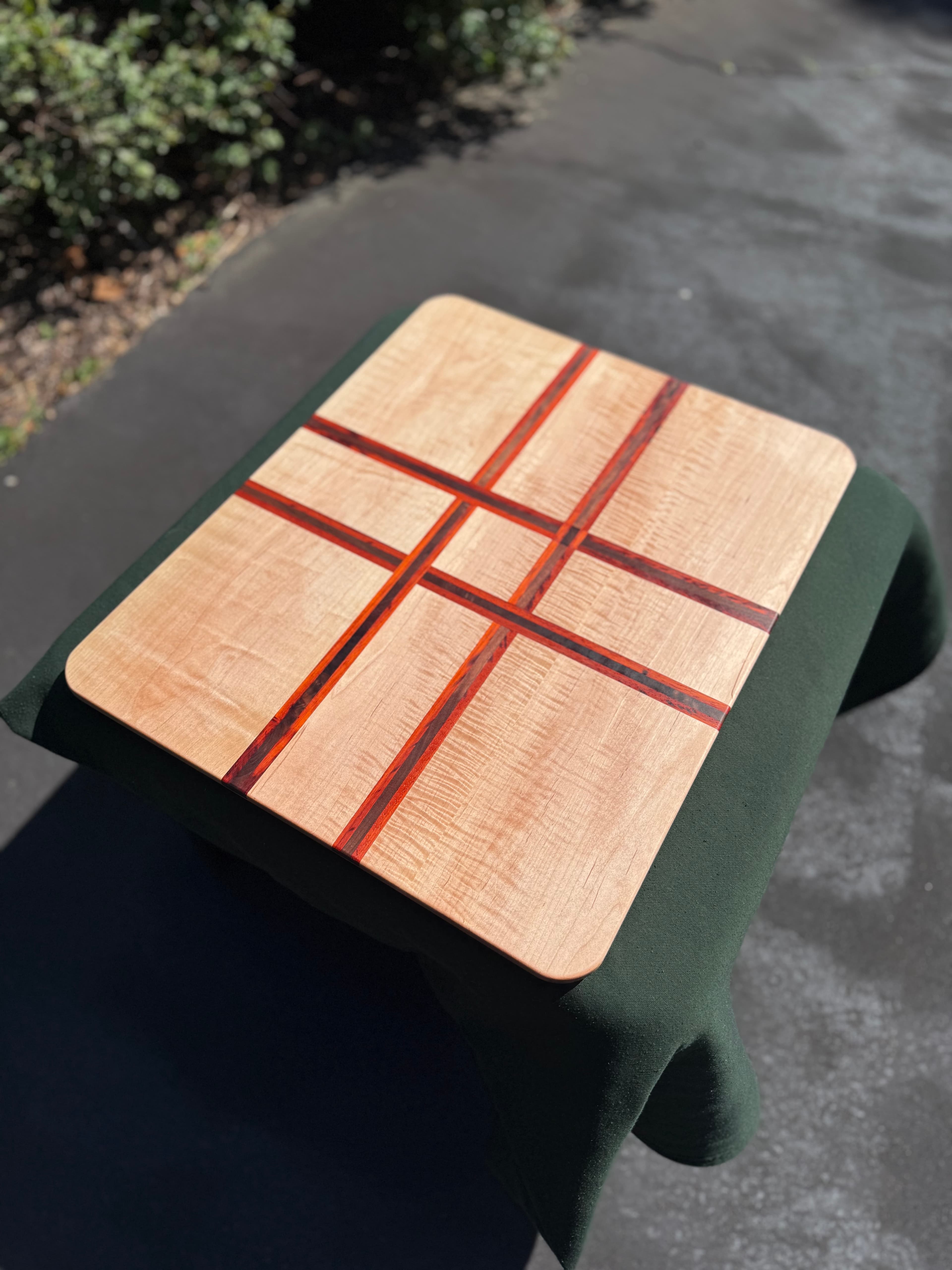Wooden serving tray with fine contrasting red and dark wood inlay